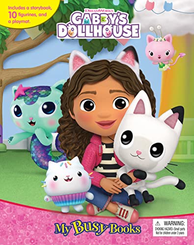 Gabby from Gabby's Dollhouse holding a white cat figurine with other characters nearby.