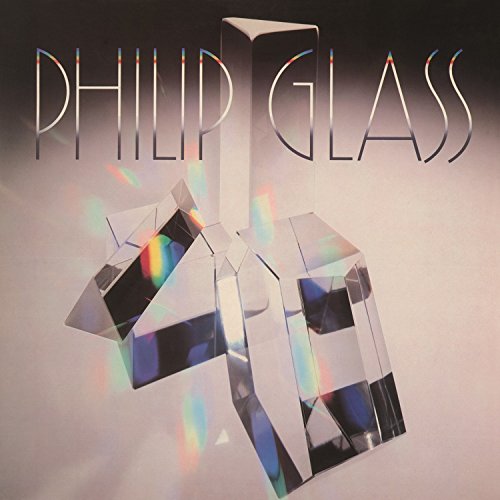 Vinyl album cover featuring geometric glass prisms reflecting rainbow light with Philip Glass text above.