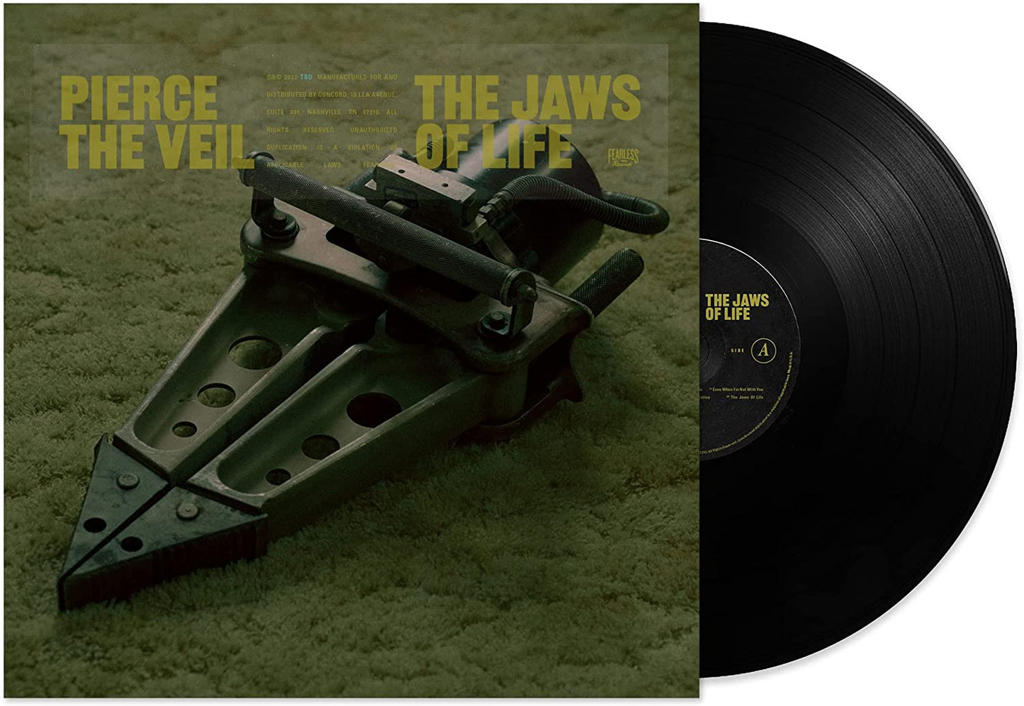 "Vinyl record and cover art featuring a hydraulic rescue tool on green carpet."