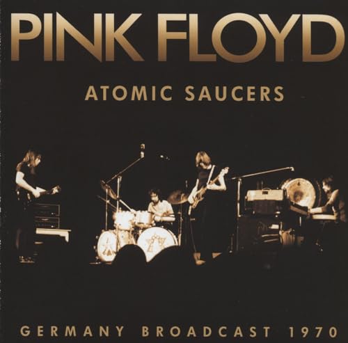 Pink Floyd “Atomic Saucers” CD cover: band performing on a dark stage.