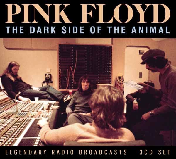 Pink Floyd album cover featuring musicians in a recording studio.