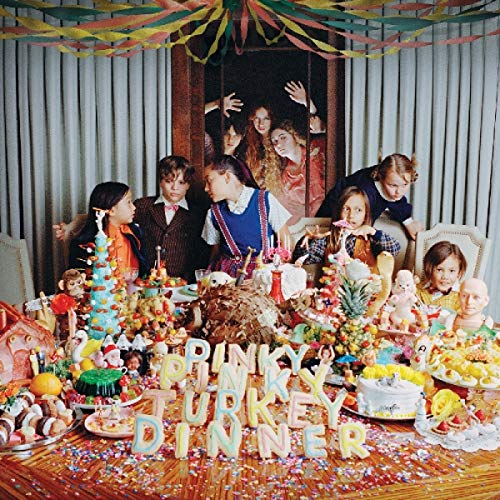 "Colorful vinyl record album cover featuring a festive table with people and food."