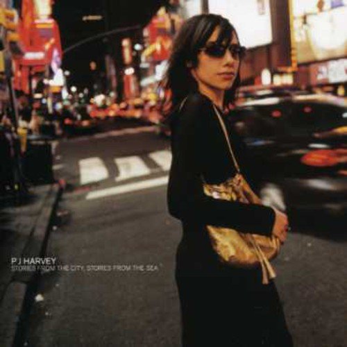 PJ Harvey album cover: woman with sunglasses in a city street.