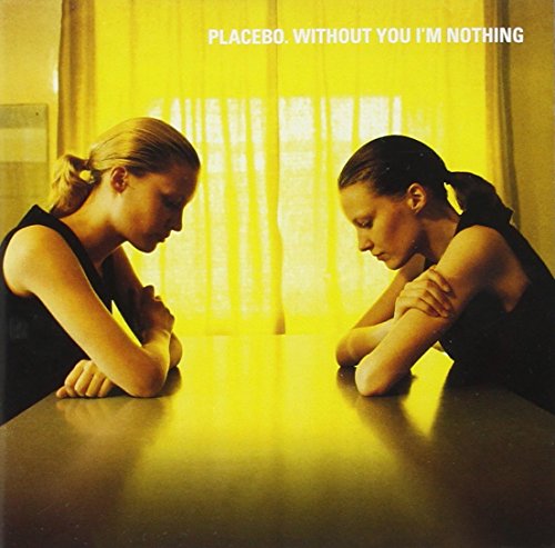 CD cover: two figures with heads bowed facing each other, yellow tone.
