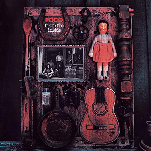 Poco album cover: rustic door with vintage objects and a framed photo.