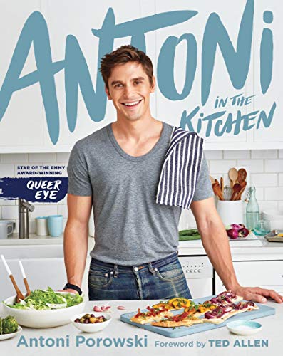 Antoni Porowski smiles on cookbook cover, “Antoni in the Kitchen.”