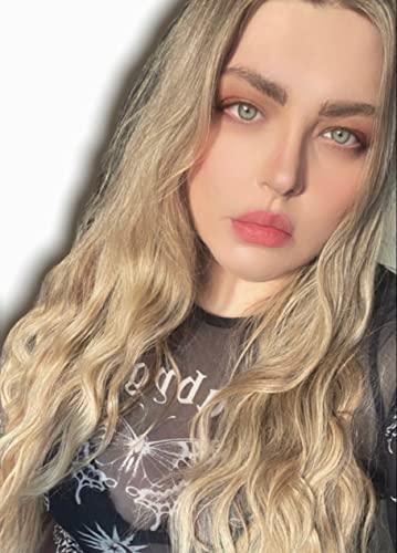 Close-up of a young woman with long, wavy blonde hair.