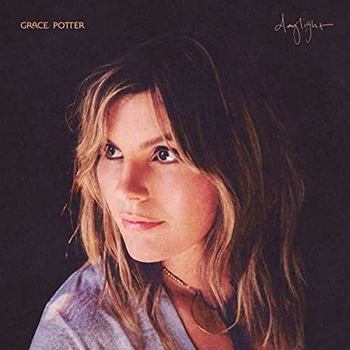 CD cover featuring a close-up portrait of a woman with wavy hair.