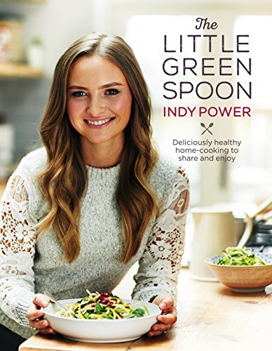 Cookbook cover featuring Indy Power smiling and holding a bowl of healthy salad.