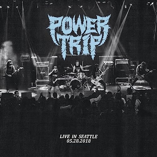 Black and white concert photo of the band Power Trip performing on stage.