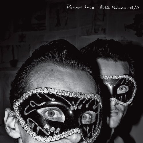Black and white album cover featuring two men wearing eye-decorated masks.