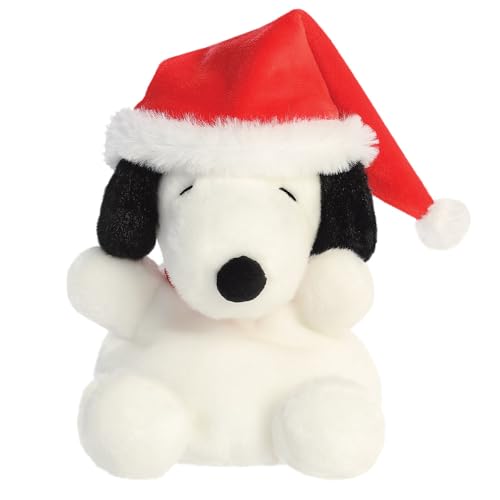 White Snoopy plush toy wearing a red Santa hat with white trim.
