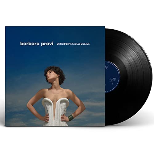 Black vinyl record with white and colored label, in a sleeve with artwork.