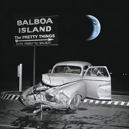 A crashed vintage car sits beneath a Balboa Island sign and a crescent moon.