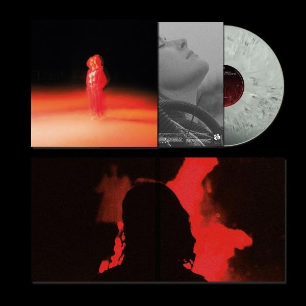 Vinyl record, album cover, and back sleeve featuring red lighting and a grey marble disc.