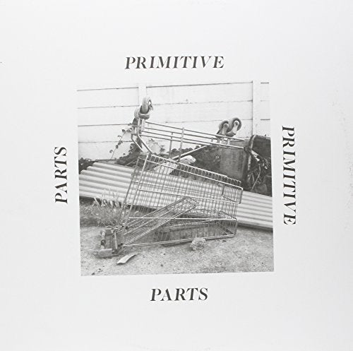 Black and white album cover featuring a pile of wrecked shopping carts.