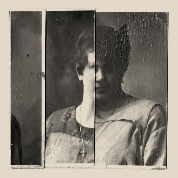 Distressed black and white portrait of a woman in vintage clothing.