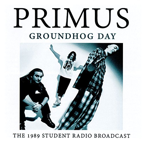 Album cover for Primus Groundhog Day featuring three band members in black and white.