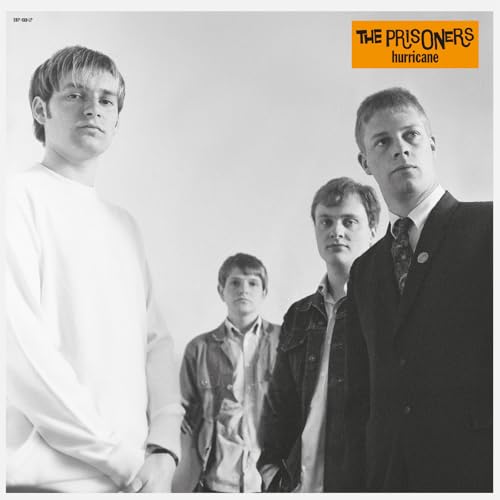 Black and white album cover featuring three young men in suits.