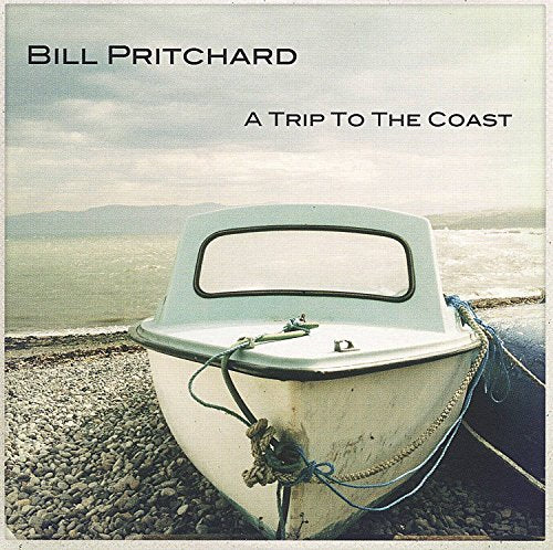 "Album cover with a white boat on a rocky shore, titled 'A Trip To The Coast'."
