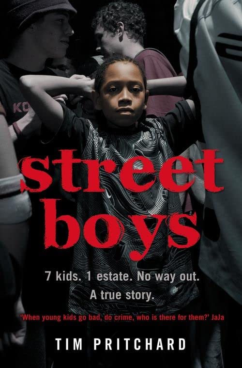 Book cover: a young boy surrounded by others, dark and serious tone.