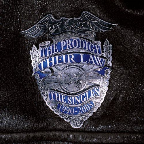 The Prodigy album cover: a silver police badge on black leather.