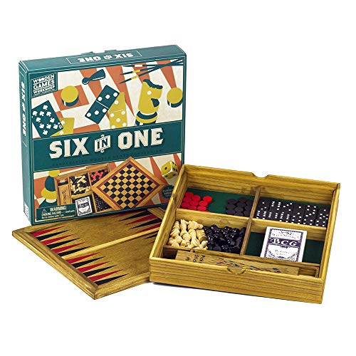 Wooden box open, revealing chess, checkers, dominoes, and other game pieces.