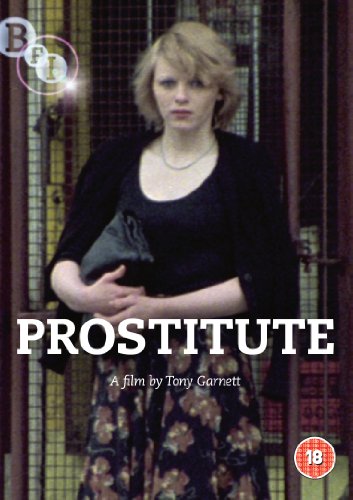 DVD cover featuring a woman in a black top standing before a metal gate.