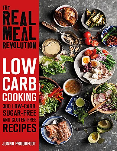 Cookbook cover with colorful food arrangement and bold red title text.