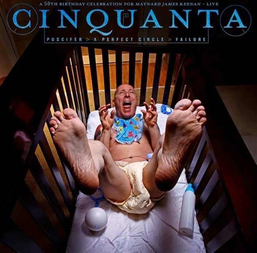 Cinquanta live album cover: man-baby in crib, feet visible.