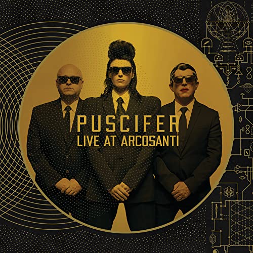 Puscifer album cover featuring three suited figures with sunglasses.