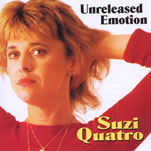 Suzi Quatro in a red sweater with hands behind her head on album cover.