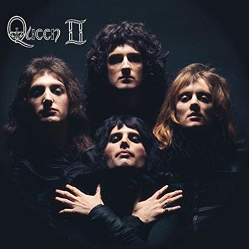 The four members of Queen posed in darkness on the Queen II album cover.
