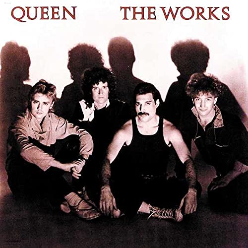 Queen album cover, "The Works," featuring the band members in silhouette.