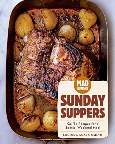 Roasted meat and potatoes in a pan with the cookbook "Mad Hungry: Sunday Suppers".