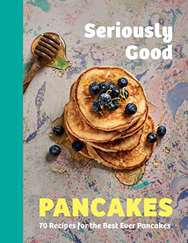 Cookbook cover with stacked pancakes, blueberries, and dripping honey.