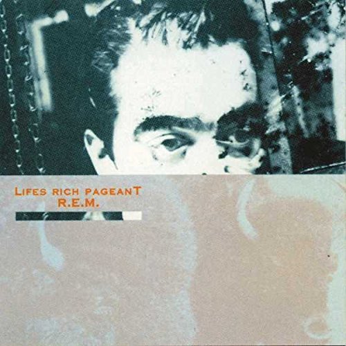 Album cover featuring a close-up of a man's eyes above a textured tan background.
