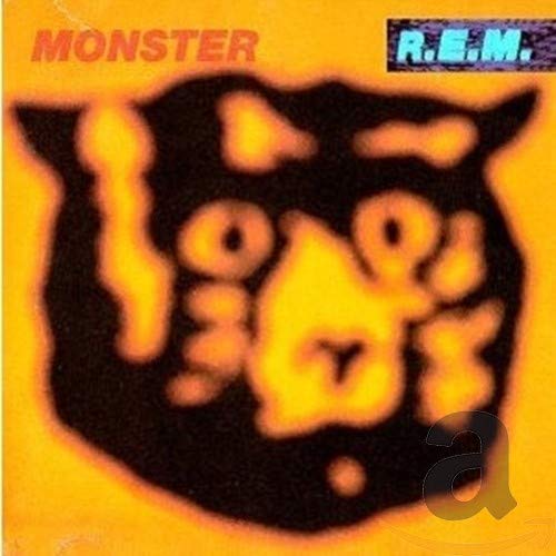 R.E.M.'s "Monster" CD cover: blurry orange and black bear-like image.