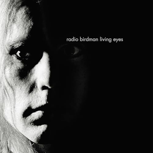 Black and white album cover featuring a close-up of a person’s face.