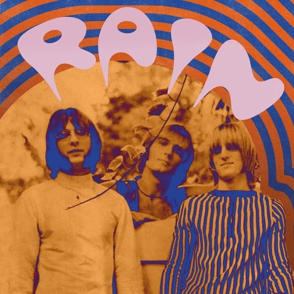 Album cover for Rain's "Tomorrow Never Comes" with three band members.