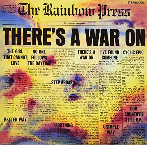 Vinyl record cover resembling a colorful, tie-dye newspaper headline.