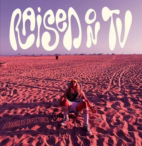 Album cover: person in chair on a beach with desert landscape.