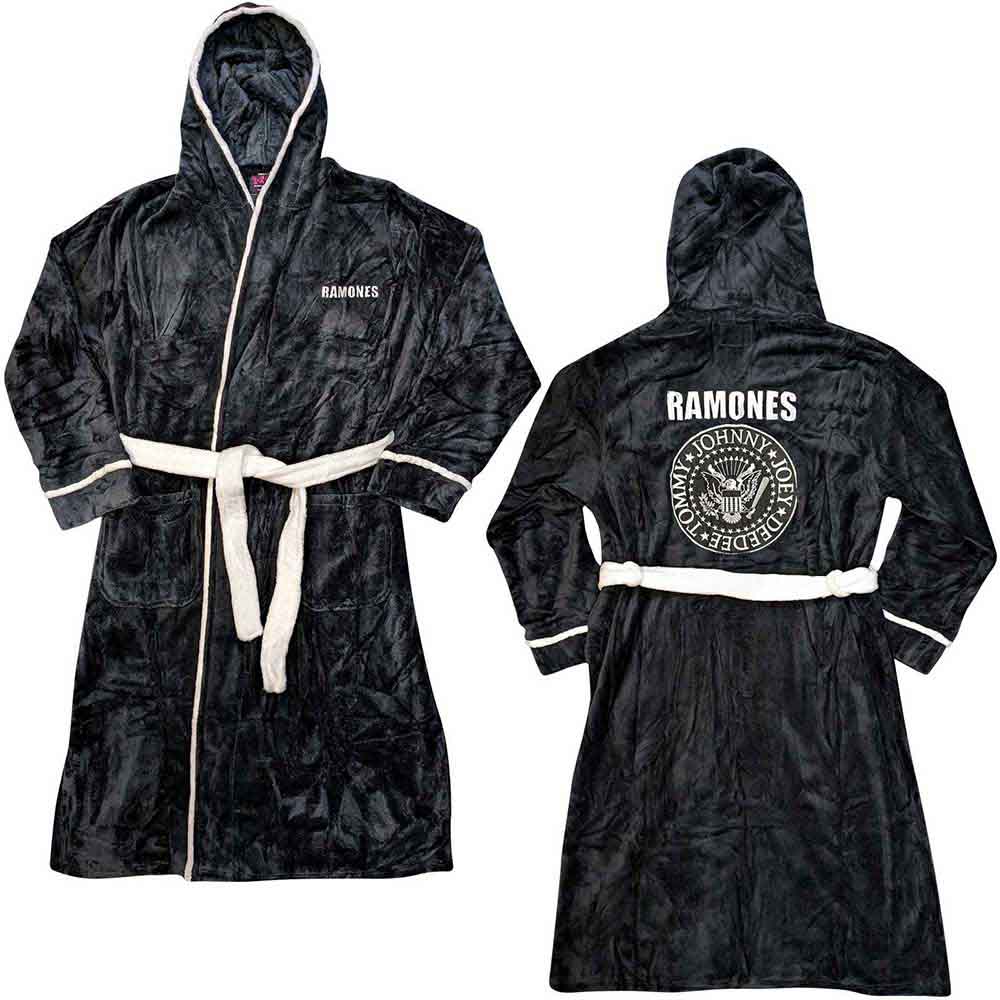 A man wearing a black fleece Ramones bathrobe with white trim against white background.