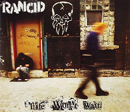 "Album cover with person sitting by door and another walking, skull graffiti above."