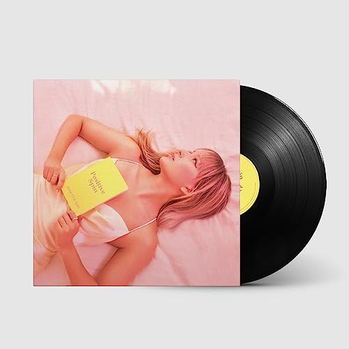 Vinyl record and album cover featuring a woman lying down.