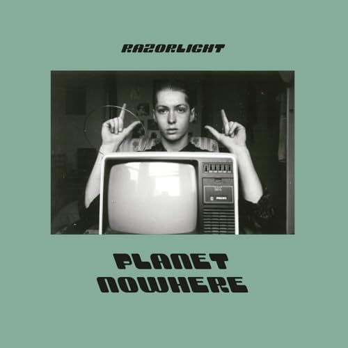 Album cover featuring a person behind a television set with Razorlight Planet Nowhere text.