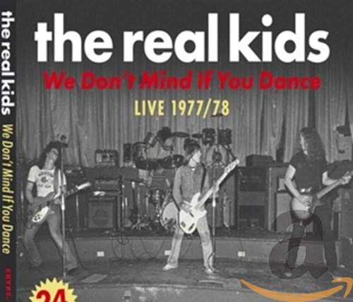 Black and white photo of a band performing live on stage, 1977/78.