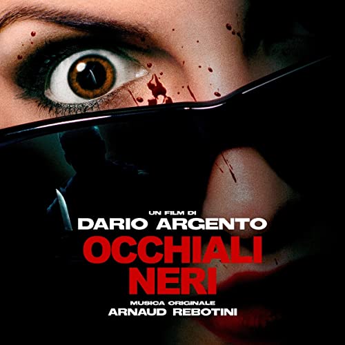 Close-up of a wide eye above dark glasses with blood splatters and movie title text.
