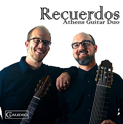Two men in black shirts holding classical guitars on a white background.