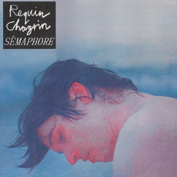 Record cover: blurry portrait of a person partially submerged in blue water.